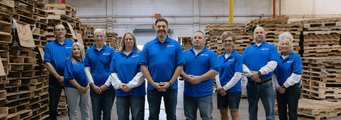 Group photo of the ABC team in blue shirts
