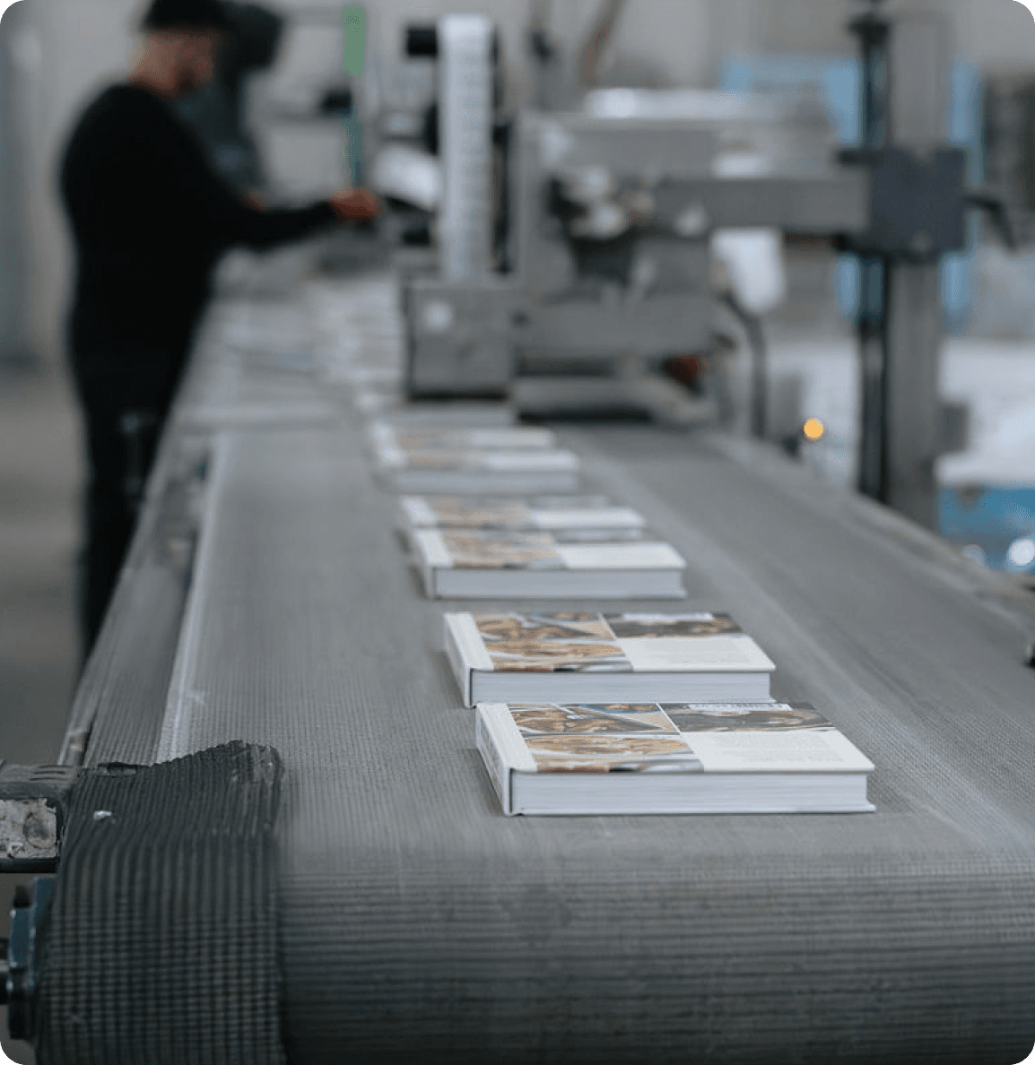 Showcasing automation of warehouse with image of books moving on conveyer belt