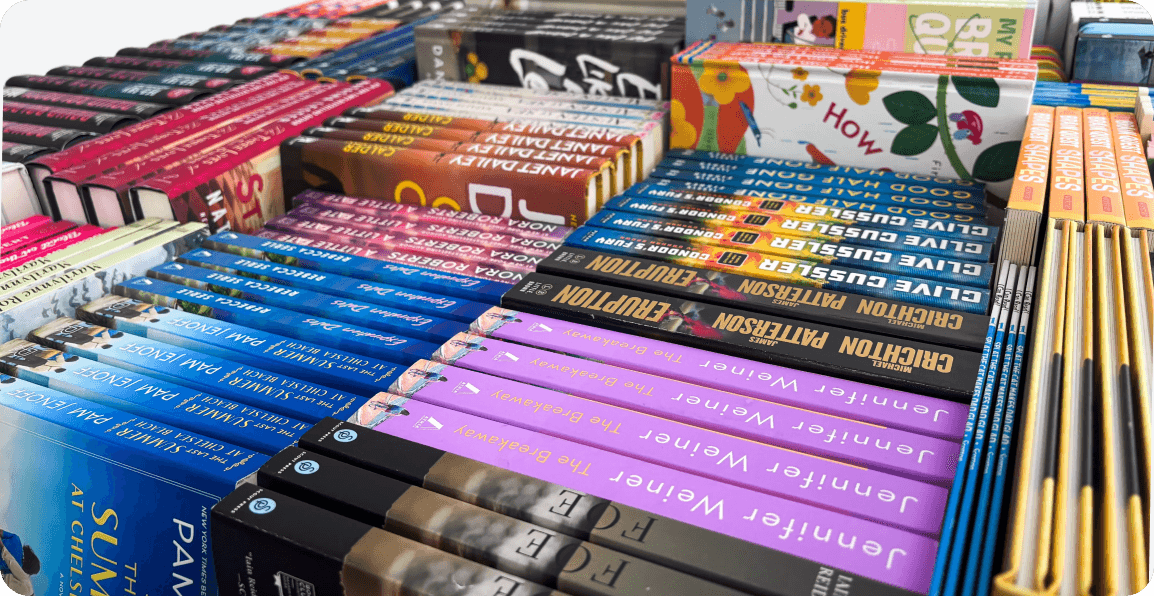 Imagery of multiple book spines displayed on top of a bargain bin box