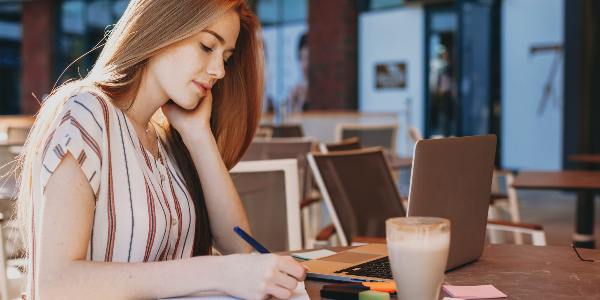 Woman writing a bok for women's history month